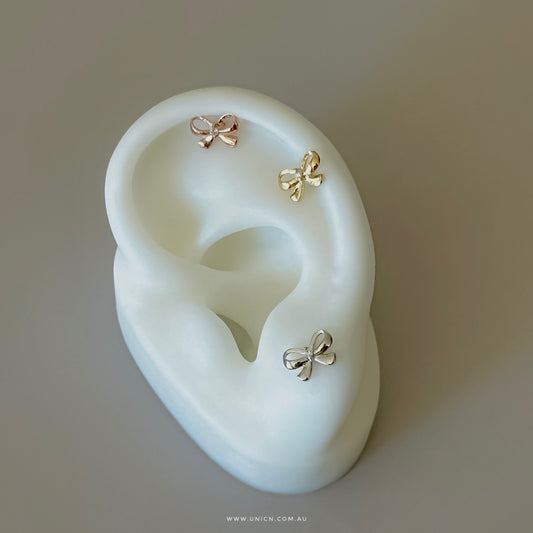 Minimalist ribbon bow earrings & piercing