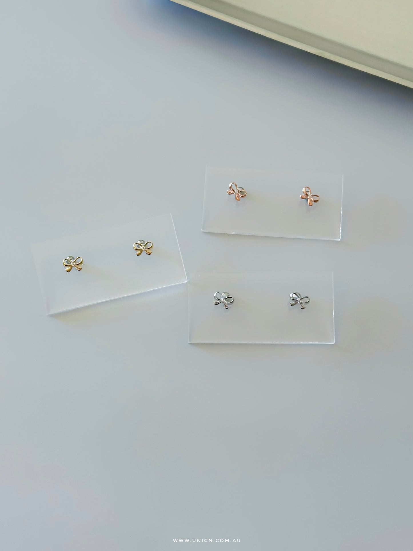 Minimalist ribbon bow earrings & piercing