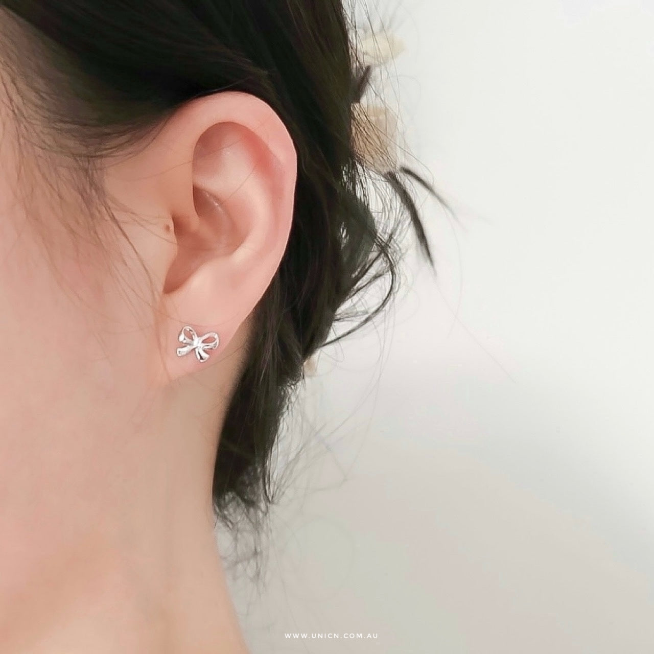 Minimalist ribbon bow earrings & piercing